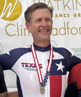 Brandon Greer wearing his Texas state time trial champion jersey and medal